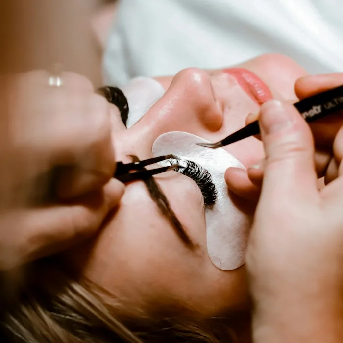 Illustrative photo of lash extensions being applied